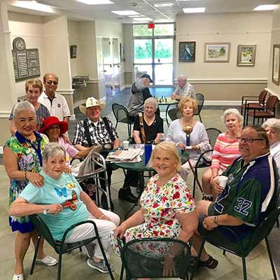 Members in hallway waiting on a class