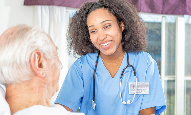 nurse with elderly male patient