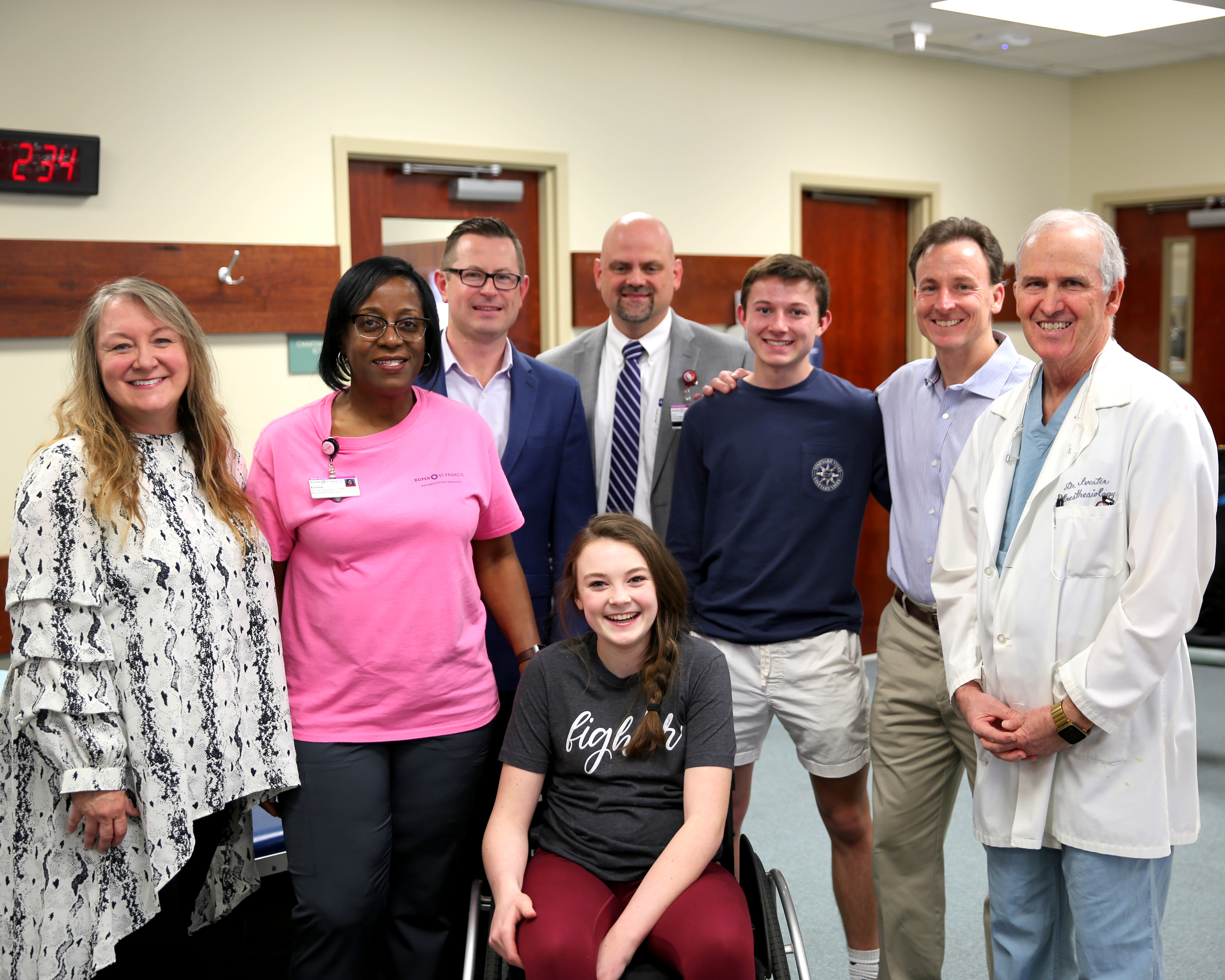 Sydney Fowler with Roper Rehabilitation Hospital staff