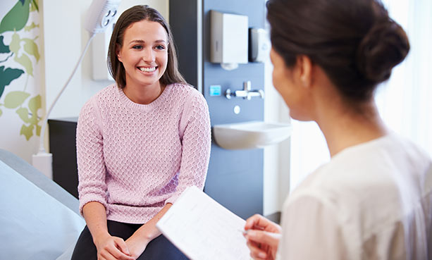 female doctor consulting with female patient