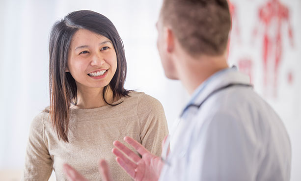 female patient talking to male doctor