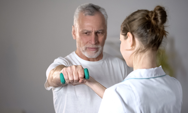 Man lifting a hand weight