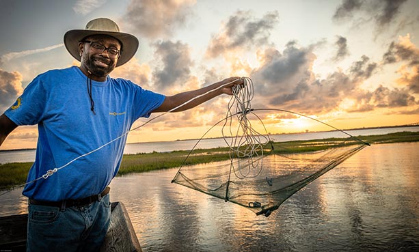 man holding crab trap